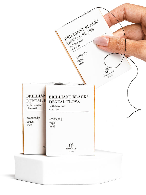 3 boxes of Terra & Co. plant-based dental floss made with bamboo charcoal and coconut oil, fluoride-free and vegan