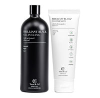 Terra & Co.'s Brilliant Black oral care set with oil pulling and toothpaste, both fluoride-free, charcoal-infused, and clinically tested for enamel safety