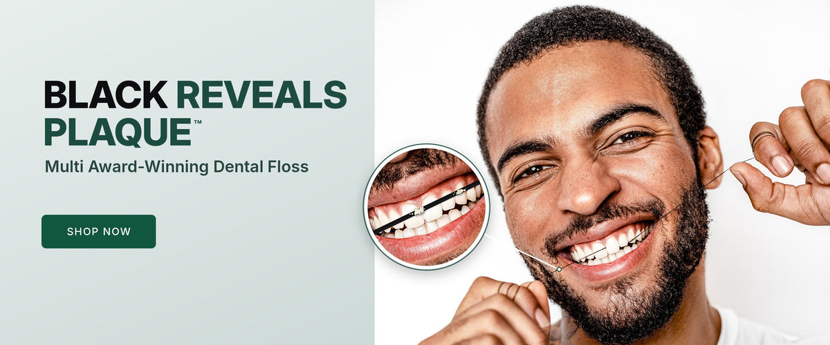 Black Reveals Plaque™ – man flossing with Brilliant Black® charcoal dental floss, close-up shows plaque on the black floss. Multi award-winning dental floss. Shop now.