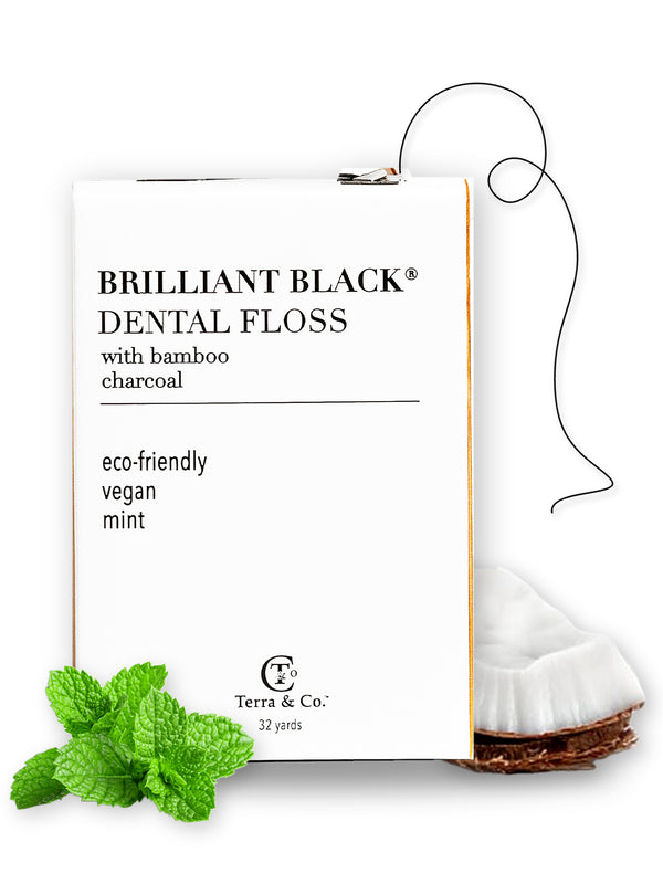 Brilliant Black® charcoal bamboo dental floss by Terra & Co. – 32-yard plastic-free box with black vegan floss, fresh peppermint leaves and coconut
