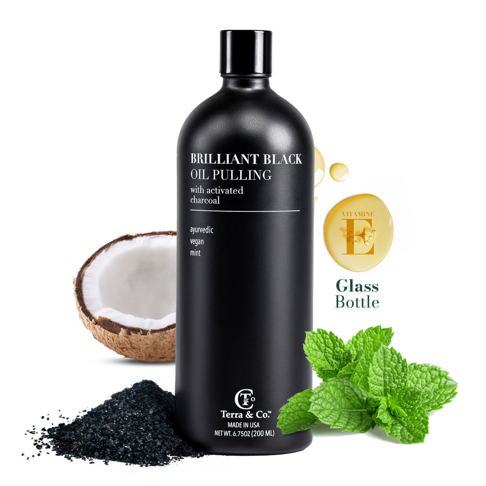 Brilliant Black® Oil Pulling by Terra & Co. in a pharmaceutical-grade glass bottle – activated charcoal oil pulling with coconut oil, MCT oil, peppermint and vitamin E for whiter-looking teeth and fresh breath, 6.75 oz