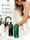 Woman oil pulling at a bathroom sink with Terra & Co. Brilliant Black® and Gentle Green® – made in USA, UV-protective glass